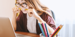 a woman having a problem while studying english reading